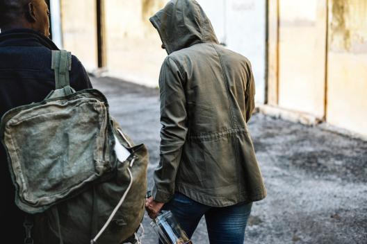Homeless people walking on street