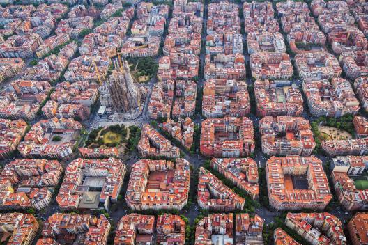 Aerial view of Barcelona Eixample residential district and Sagrada familia, Spain. Late afternoon light