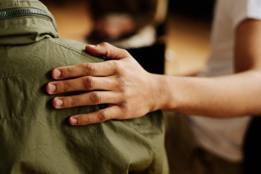 A hand on a shoulder