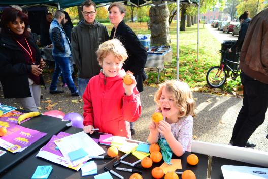 Two children eating fruit