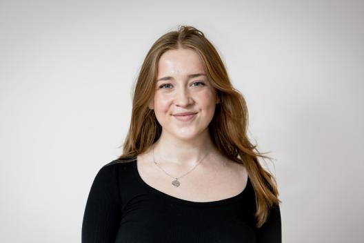 Laura smiling at the camera
