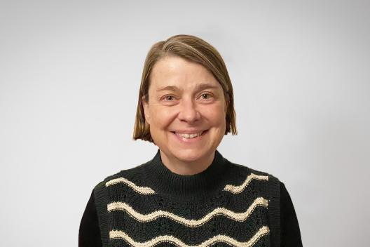 Charlotte smiling at the camera. 