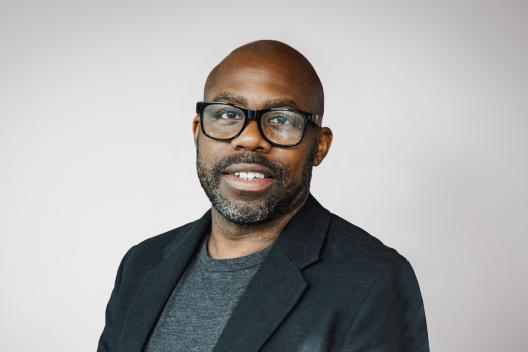 Shane Ryan smiling at the camera. 