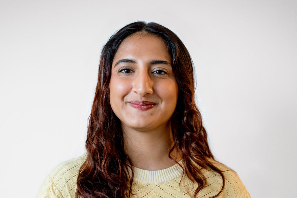 Ria Malhotra smiles at the camera