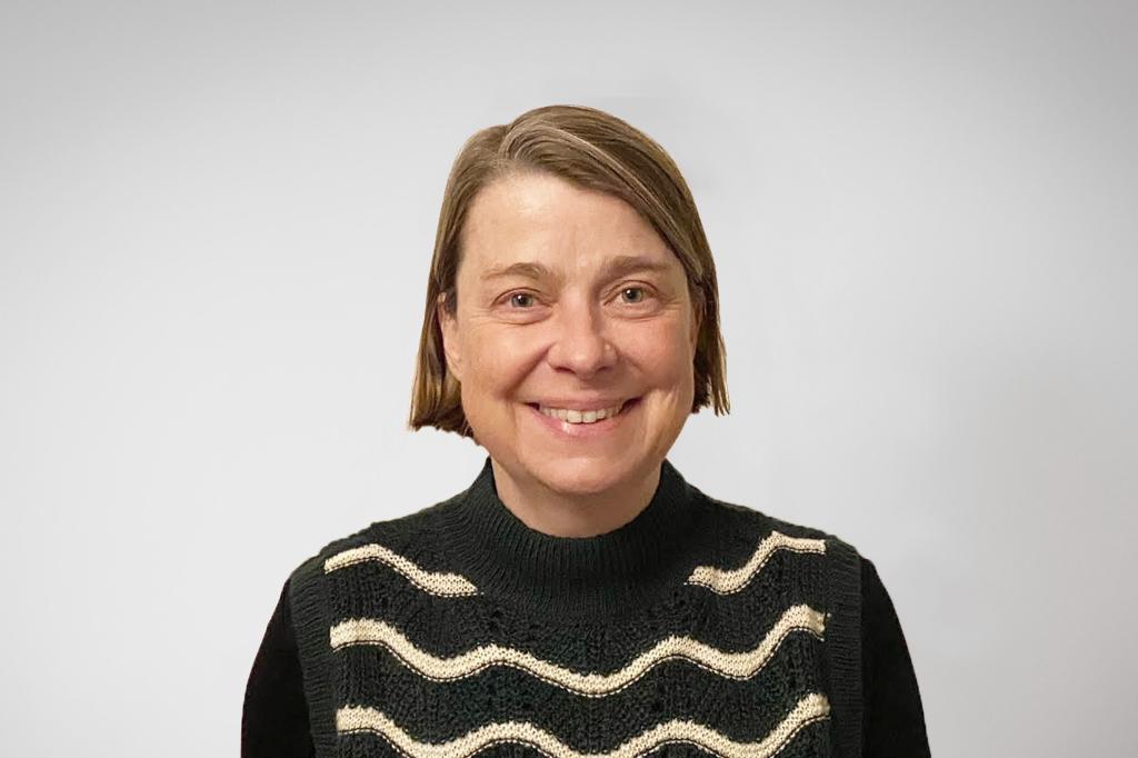 Charlotte smiling at the camera. 