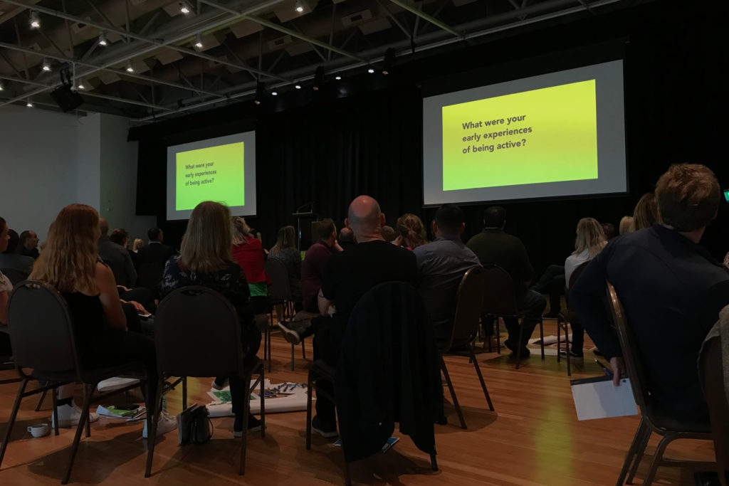 Photo of Sport New Zealand Ihi Aotearoa staff watching a short video of three interviewees sharing their stories of what being active means to them.